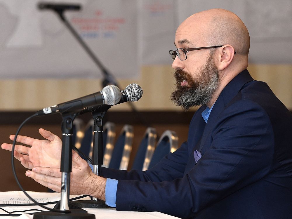 Duncan Kinney, executive director of Progress Alberta, speaks at an Alberta Electoral Boundaries Commission hearing in 2017. Kinney is currently charged with mischief for allegedly spray painting a statue he later wrote about.
