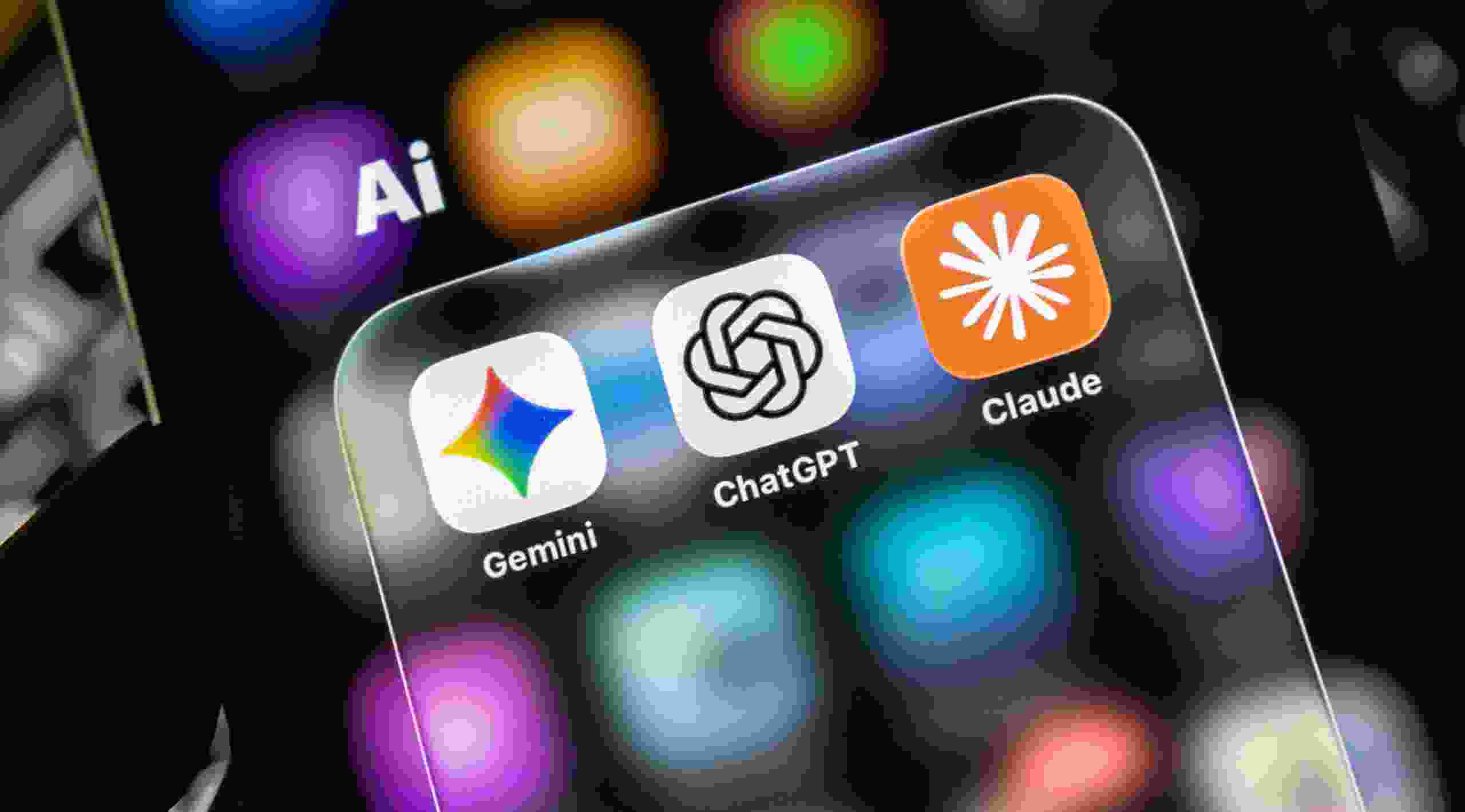 Closeup of a smartphone screen displaying popular artificial intelligence mobile application icons including gemini, chatgpt, and claude