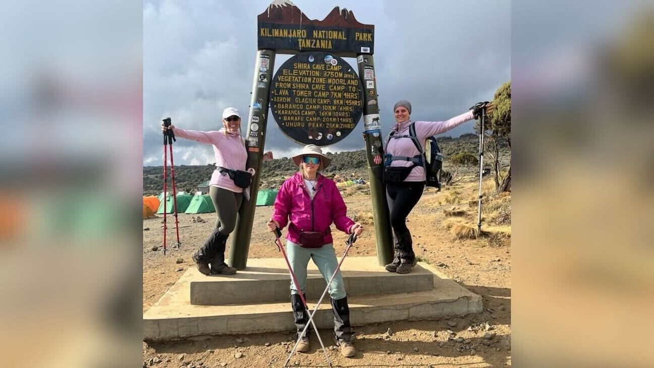 Three women climb Mount Kilimanjaro.