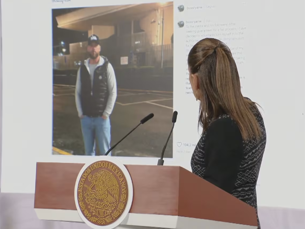Mexican President Claudia Sheinbaum looks at the fake image of Ryan Wedding