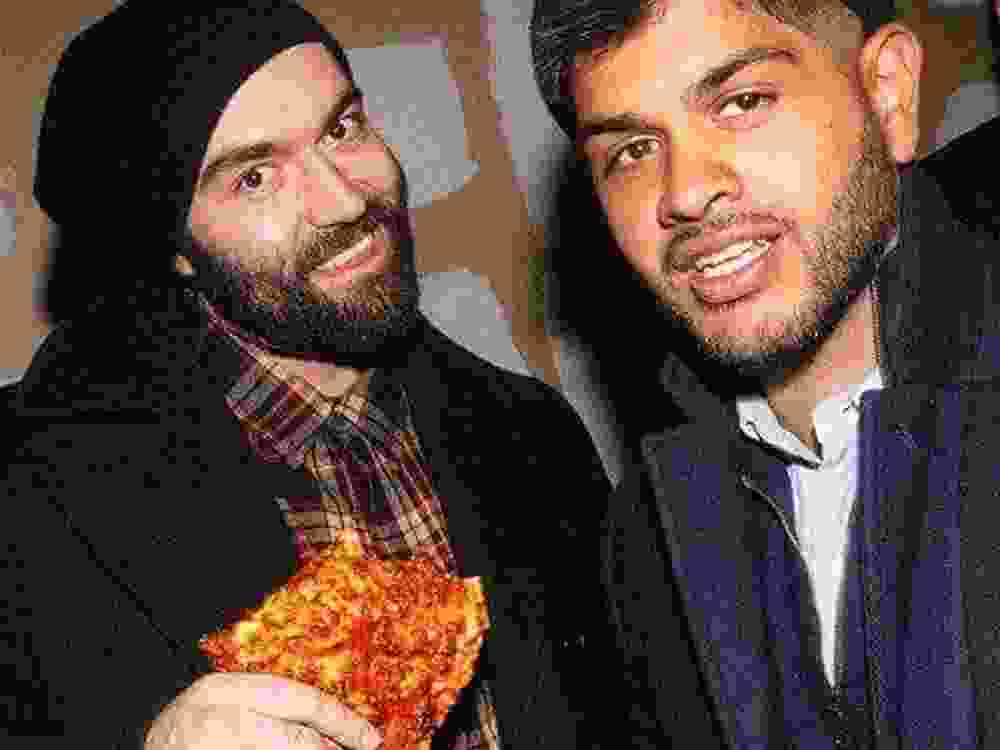 Slava and Ali pose for a photo together