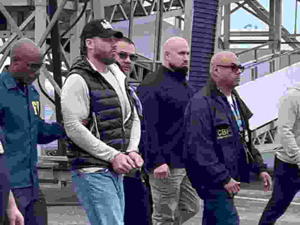 Ryan Wedding is escorted by FBI agents