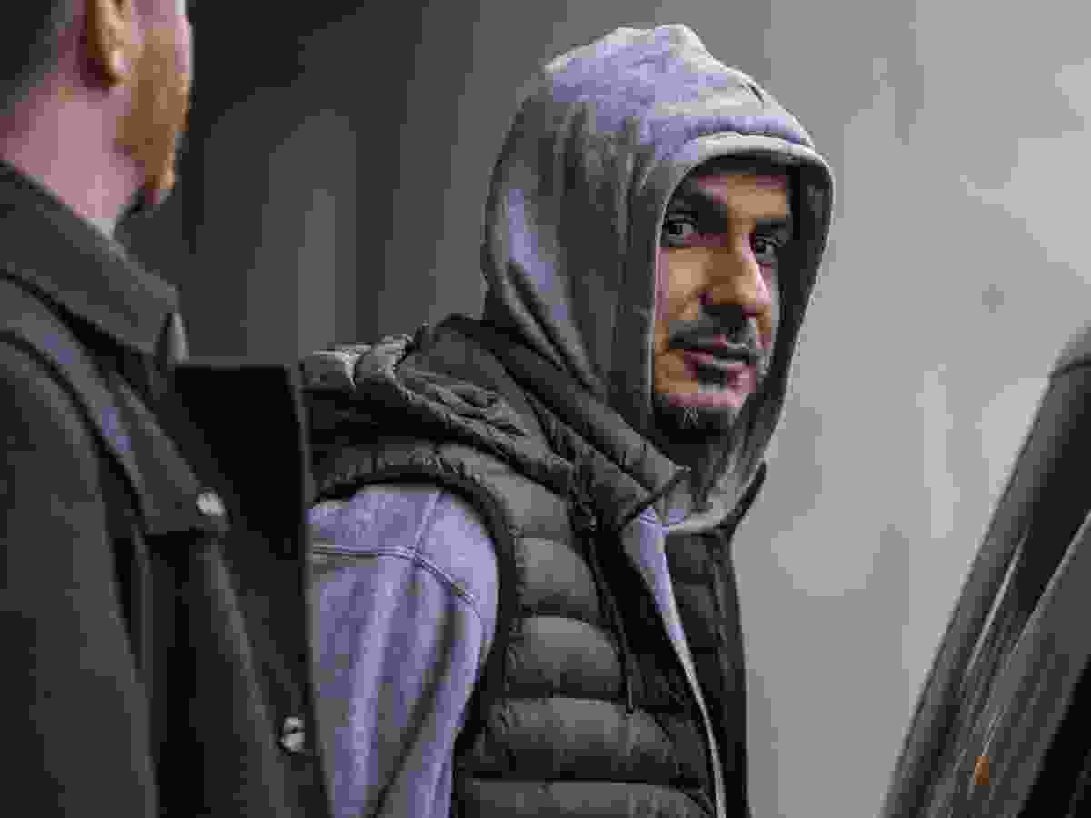 Arsalan Chaudhary wearing a hoodie and vest