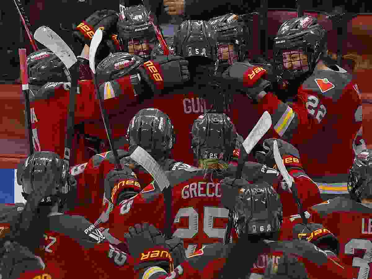 Michela Cava from the Ottawa Charge celebrates her double-overtime winning goal with her teammates on Sunday at the Canadian Tire Centre. Ottawa defeated Boston 4-3 in Game 4 to take the semifinal series 3-1.