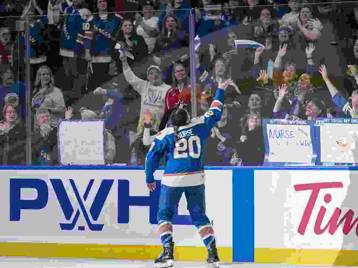 Sarah Nurse #20 of the Vancouver Goldeneyes throws a puck to the fans after being named the first star of the game against the Seattle Torrent in PWHL action at Pacific Coliseum on November 21, 2025 in Vancouver, Canada.