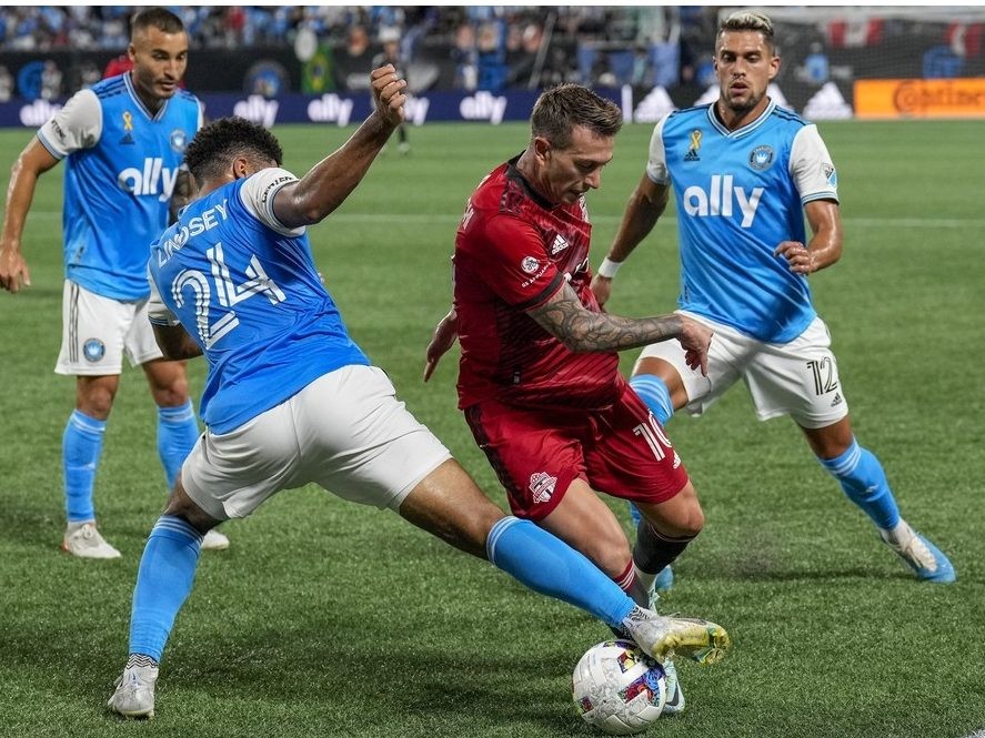 Aug 27, 2022; Charlotte, North Carolina, USA; Charlotte FC defender Jaylin Lindsey tries for a steal from Toronto FC Frederico Bernardeschi during the second half at Bank of America Stadium.