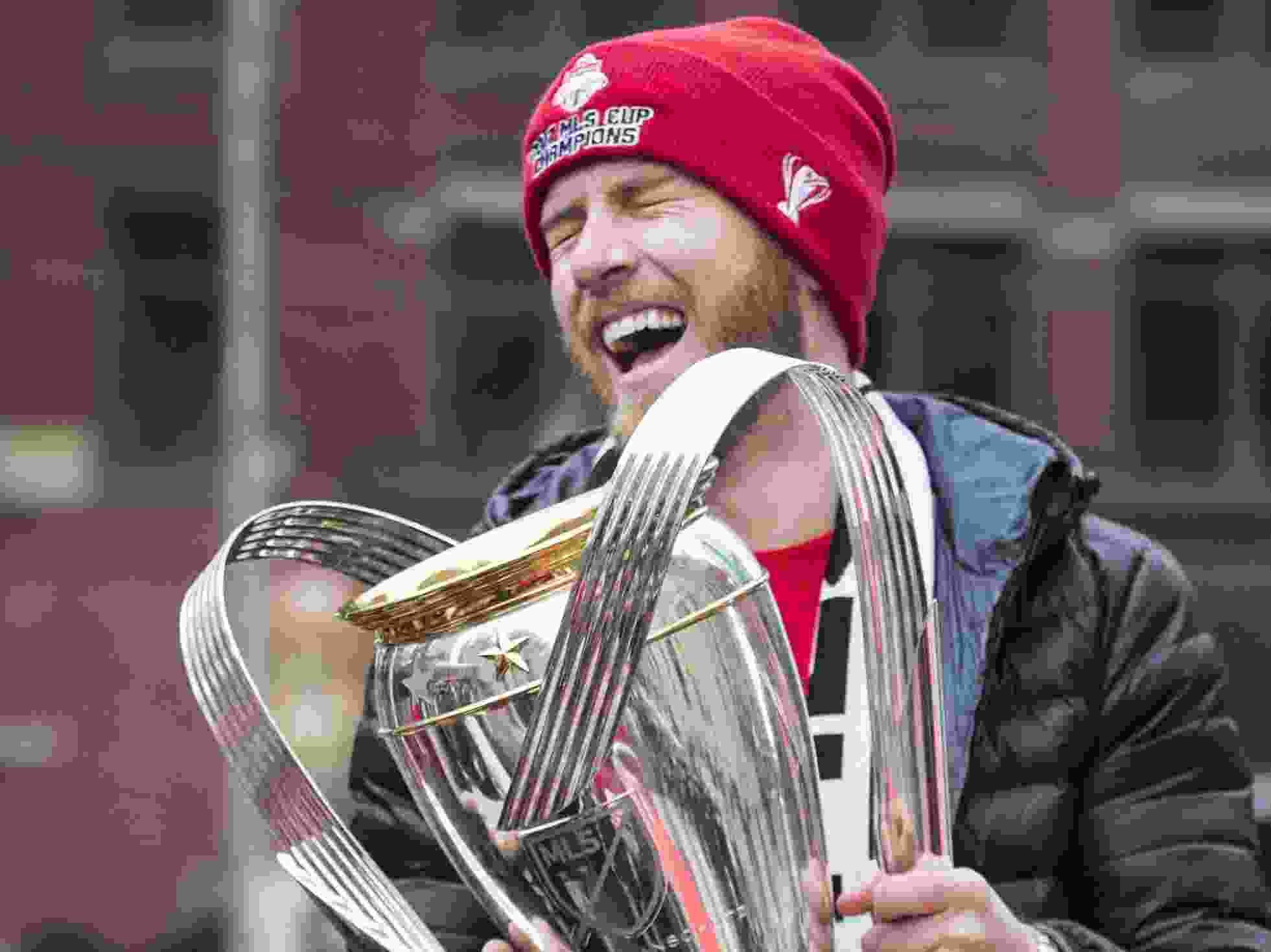 Toronto FC midfielder Michael Bradley celebrates with the MLS Cup during Toronto FC's parade in 2017.
