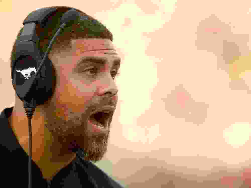 Former Stamps coach Corey Mace on the sidelines during CFL football action between the Saskatchewan Roughriders and the Calgary Stampeders at McMahon Stadium in Calgary on Saturday, October 2, 2021.