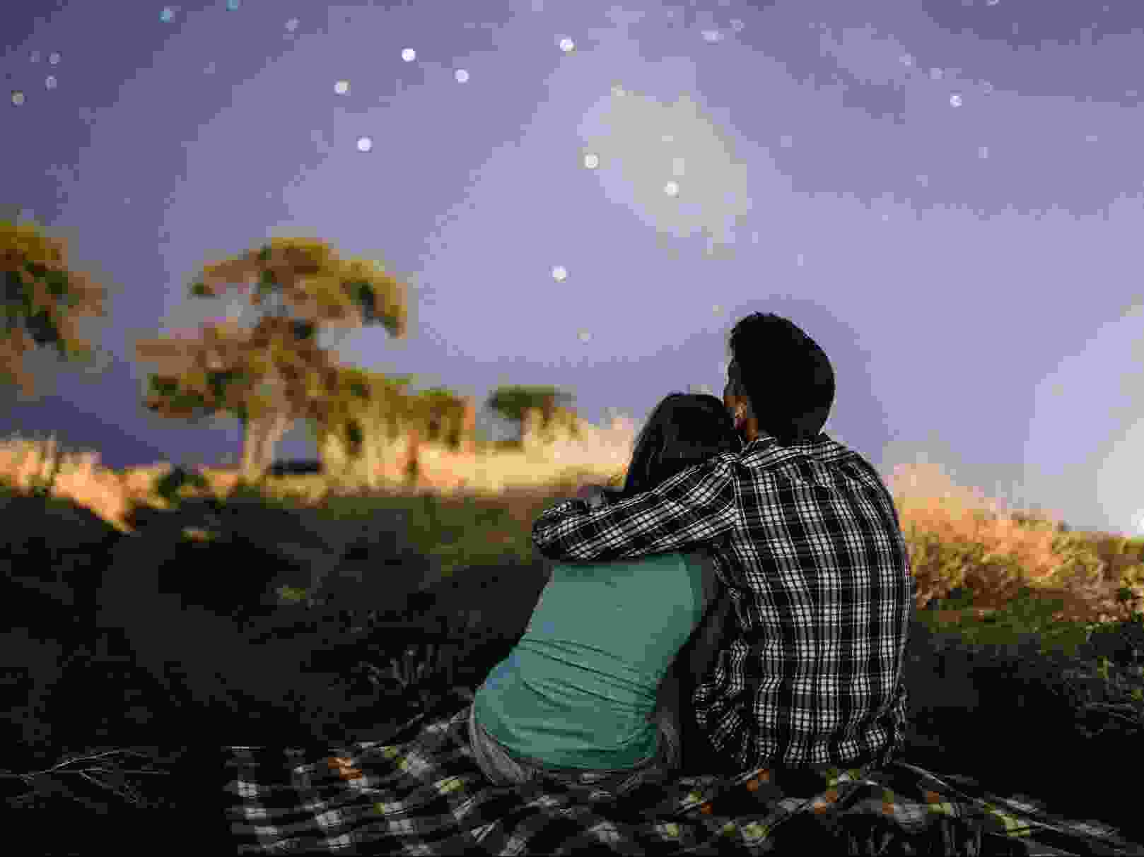 Couple in love looking up at the stars.