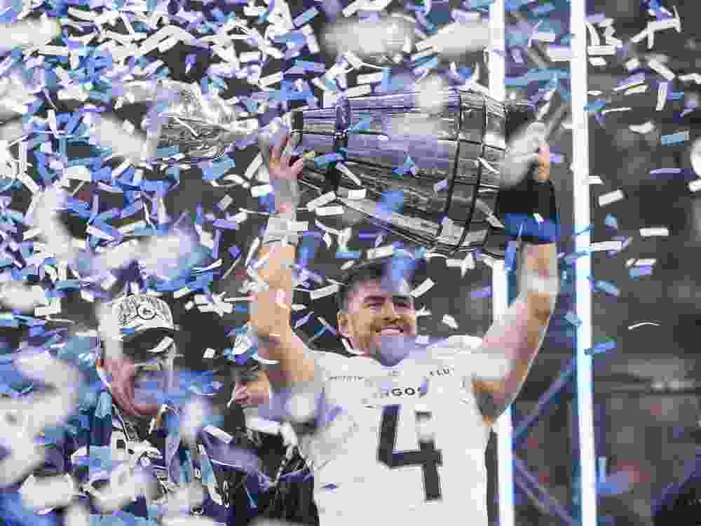 VANCOUVER, CANADA - NOVEMBER 17: Quarterback Nick Arbuckle #4 of the Toronto Argonauts lifts the Grey Cup after defeating the Winnipeg Blue Bombers in the 2024 Grey Cup at BC Place on November 17, 2024 in Vancouver, Canada.