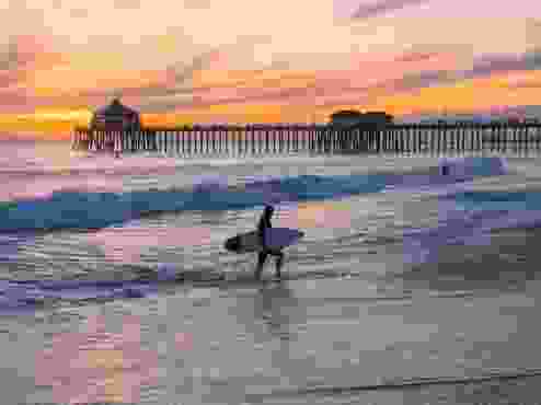 It’s called Surf City USA for a reason: From sunrise to sunset, surfers of all skill level can be found seeking the next big wave. CREDIT:&nbsp;Visit Huntington Beach
