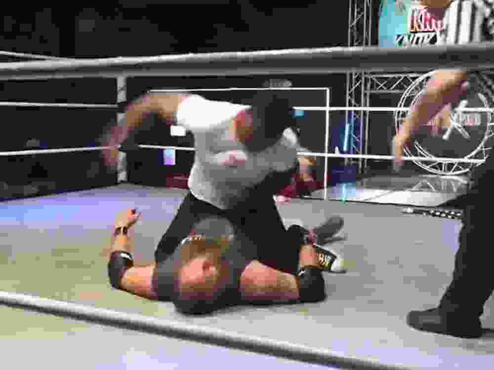 Raja Jackson lands several punches to the head and face of professional wrestler Syko Stu.