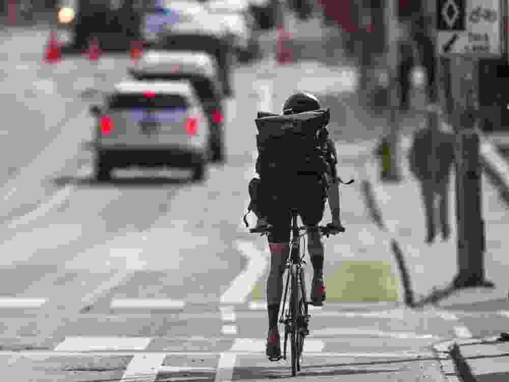 A cyclist in the bike lane along Bloor St. W., near Christie St. in Toronto, Ont. on Thursday May 9, 2019.