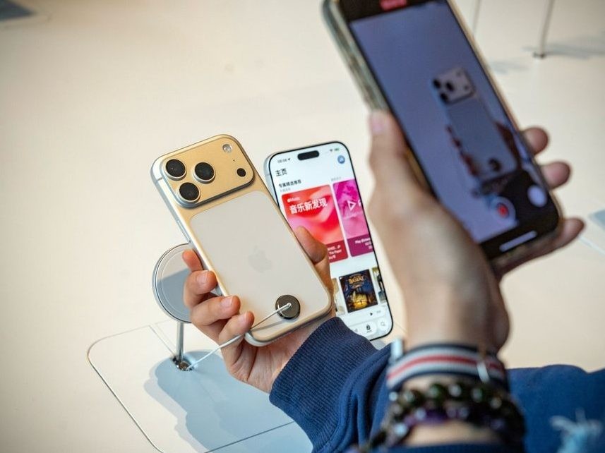 A customer looks at an iPhone 17 at an Apple Store in Beijing.
