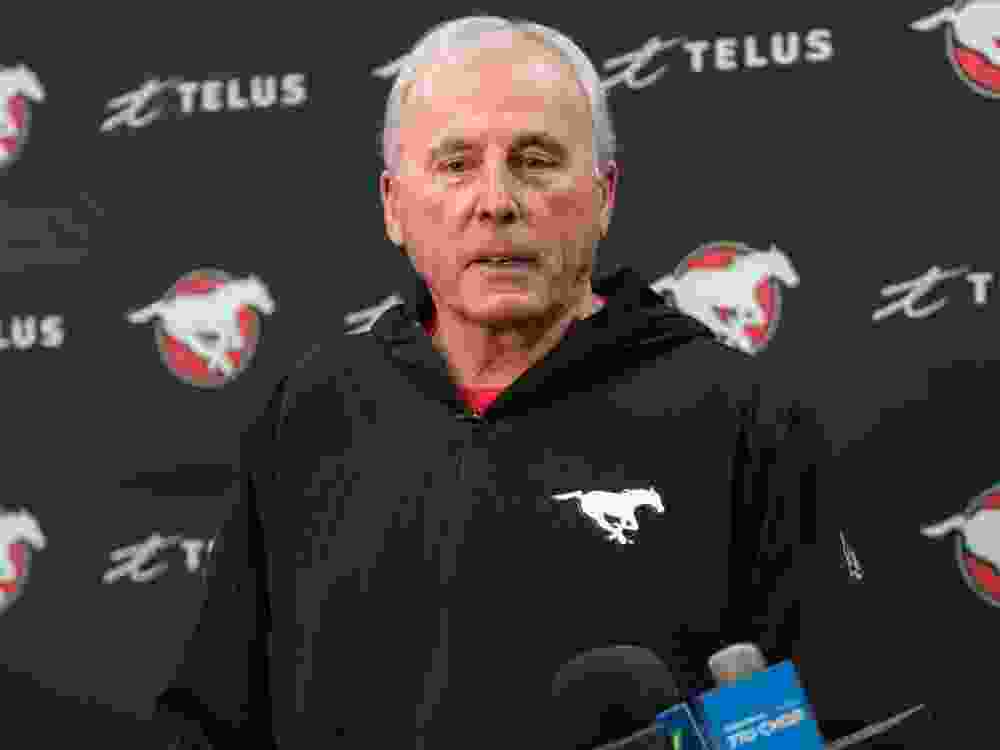 Former Stampeders team president John Hufnagel speaks at a press conference in 2022.