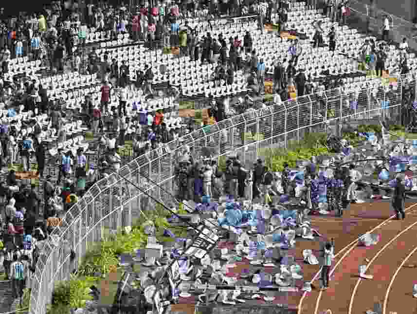Fans threw chairs onto the track of a stadium in Kolkata following an appearance of football star Lionel Messi.