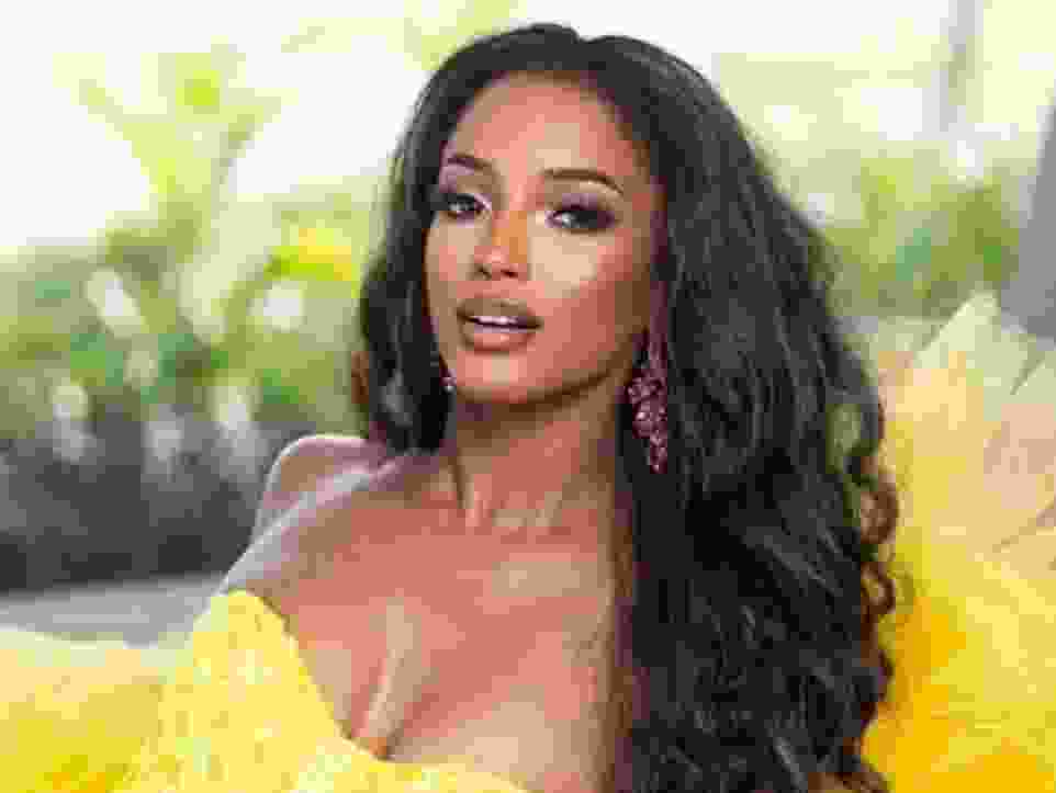 Miss Jamaica Dr. Gabrielle Henry looking sultry in yellow dress.