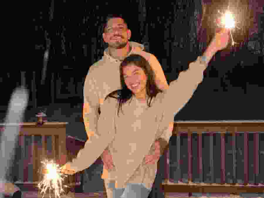 UFC star Alex Pereira shared this photo posing with fellow fighter Tracy Cortez early New Year's Day as they become the newest power couple inside the octagon.
