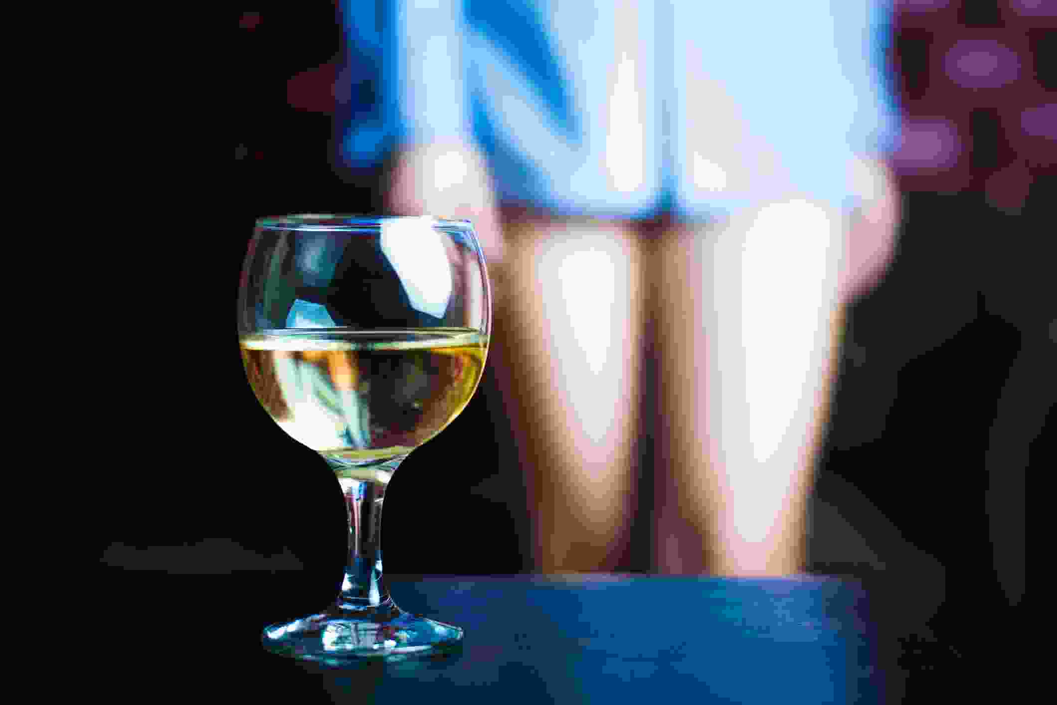 Glass of wine and naked legs.