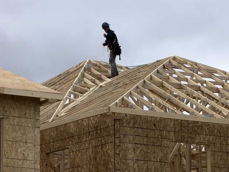 A framer works on a new home build in Aurora, Wednesday May 14, 2025.