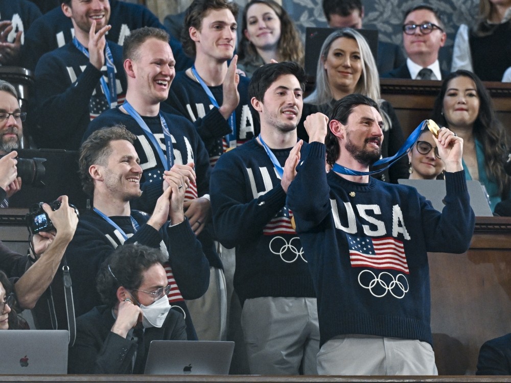 The U.S. men's Olympic ice hockey team with Connor Hellebuyck in front attend President Donald Trump's State of the Union address on Tuesday.