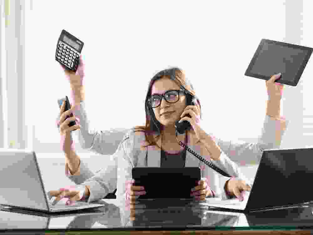 Multitasking Businesswoman In Office