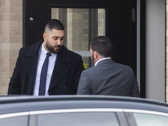 Toronto Police Service officer Const. Elias Mouawad (left) leaves 22 Division in Etobicoke on Thursday February 5, 2026. Const. Mouawadis one of seven TPS officers and one now-retired cop arrested as part of a bombshell, wide-ranging probe into police corruption. Ernest Doroszuk/Toronto Sun/Postmedia