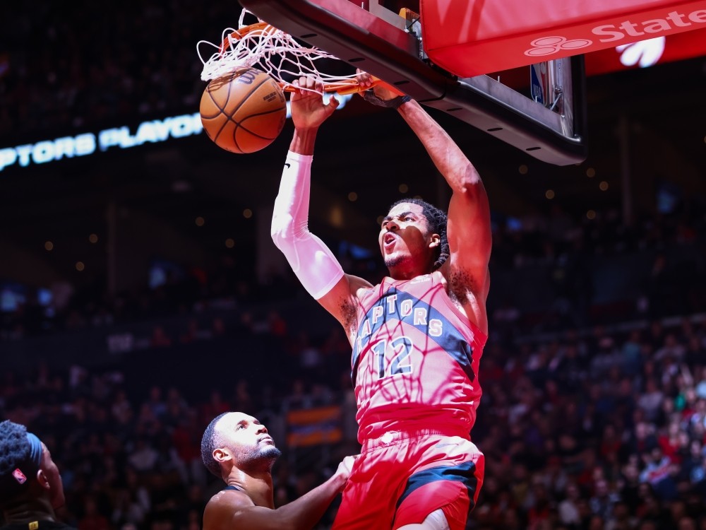 Collin Murray-Boyles of the Toronto Raptors dunks against Evan Mobley of the Cleveland Cavaliers during Game 4.
