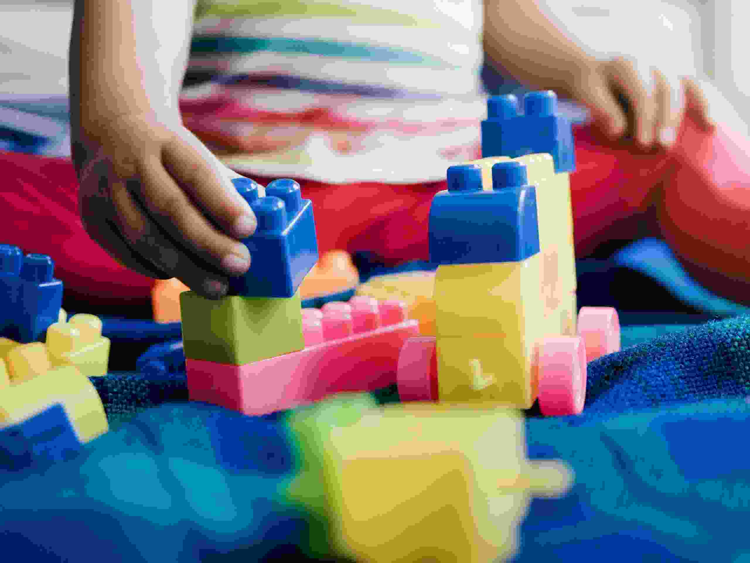 Kindergarten, Child playing with brick toys at daycare nursery. Education development games for school toddlers kids