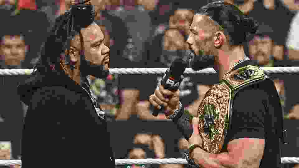 men in ring with mic
