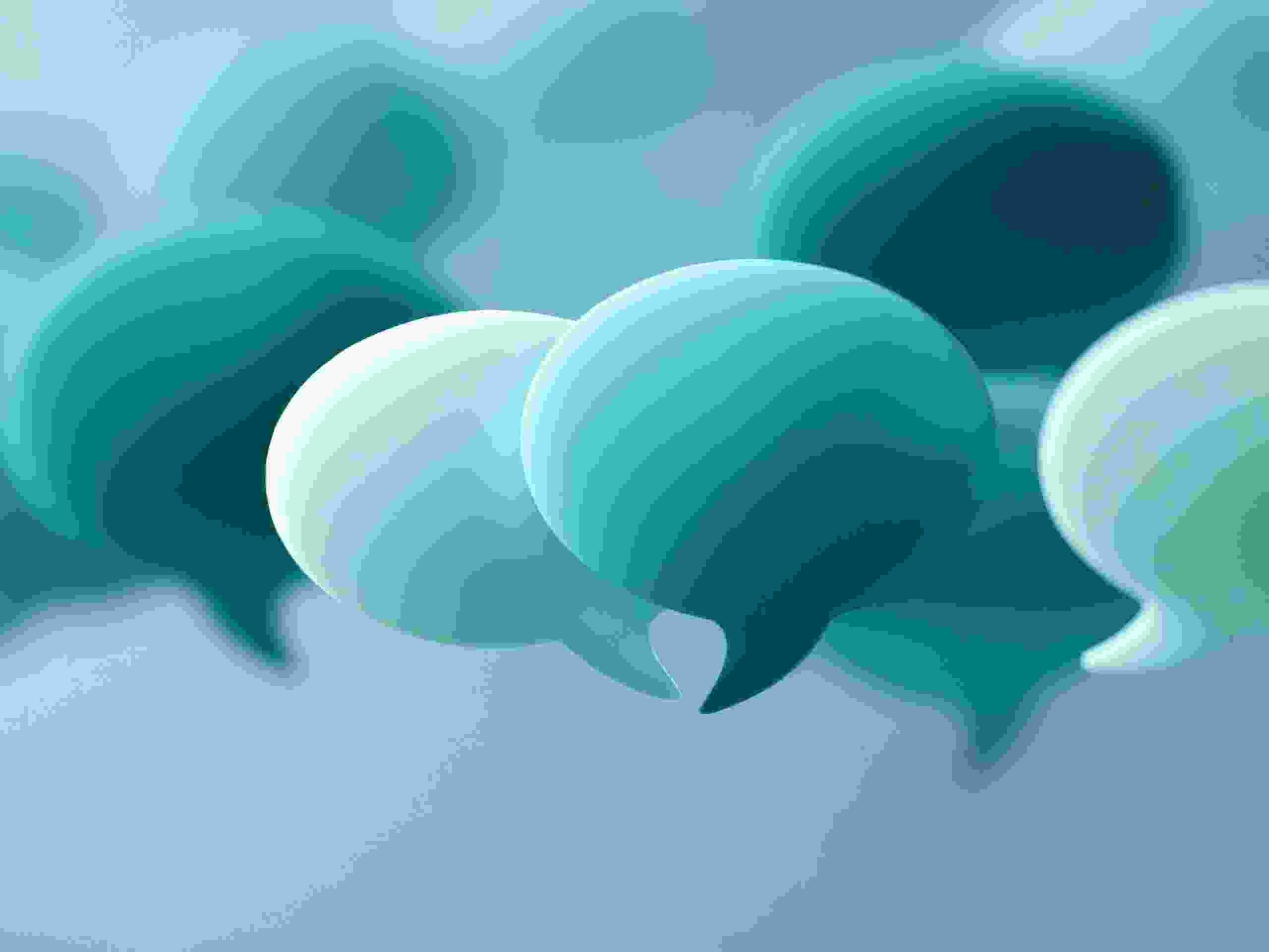 Abstract composition of floating speech bubbles in various shades of teal and blue with soft focus background representing communication and dialogue