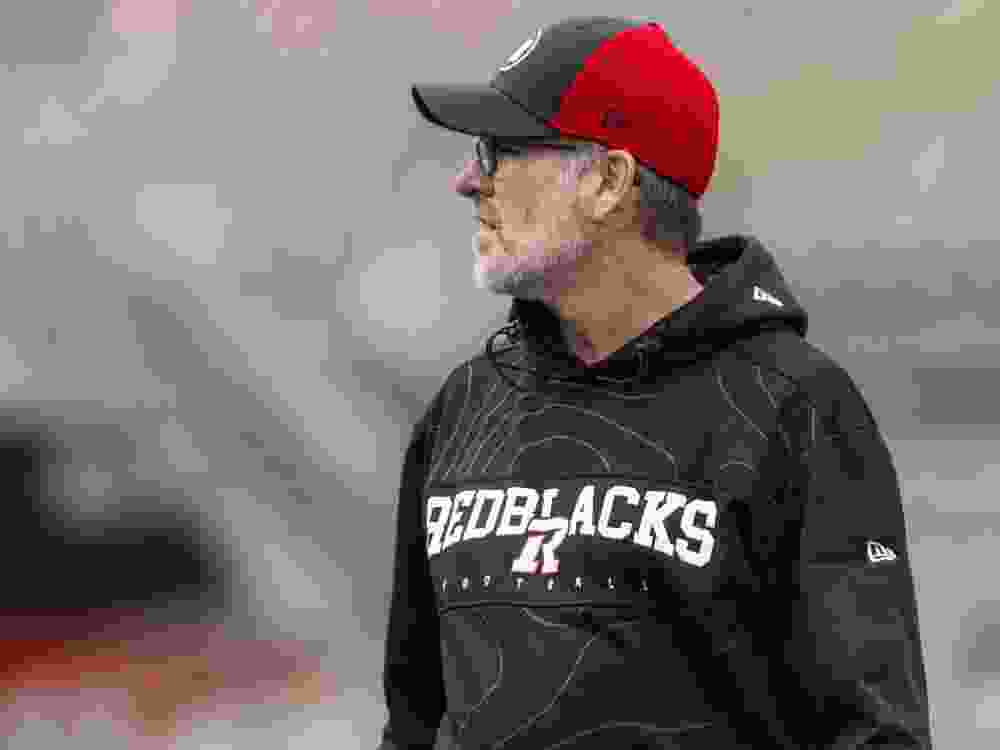 Ryan Dinwiddie, head coach and general manager of the Ottawa Redblacks, stands on the field during the team’s annual Fan Fest earlier this year.