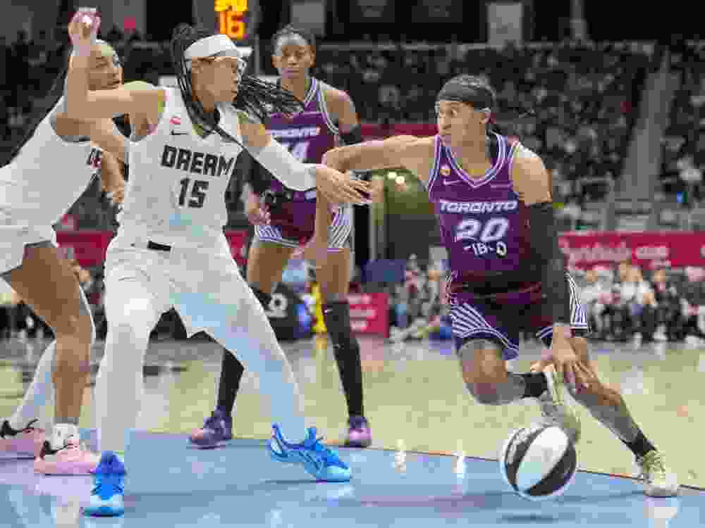 Brittney Sykes of the Toronto Tempo dribbles the ball during the WNBA Commissioner's Cup game against Allisha Gray of the Atlanta Dream.