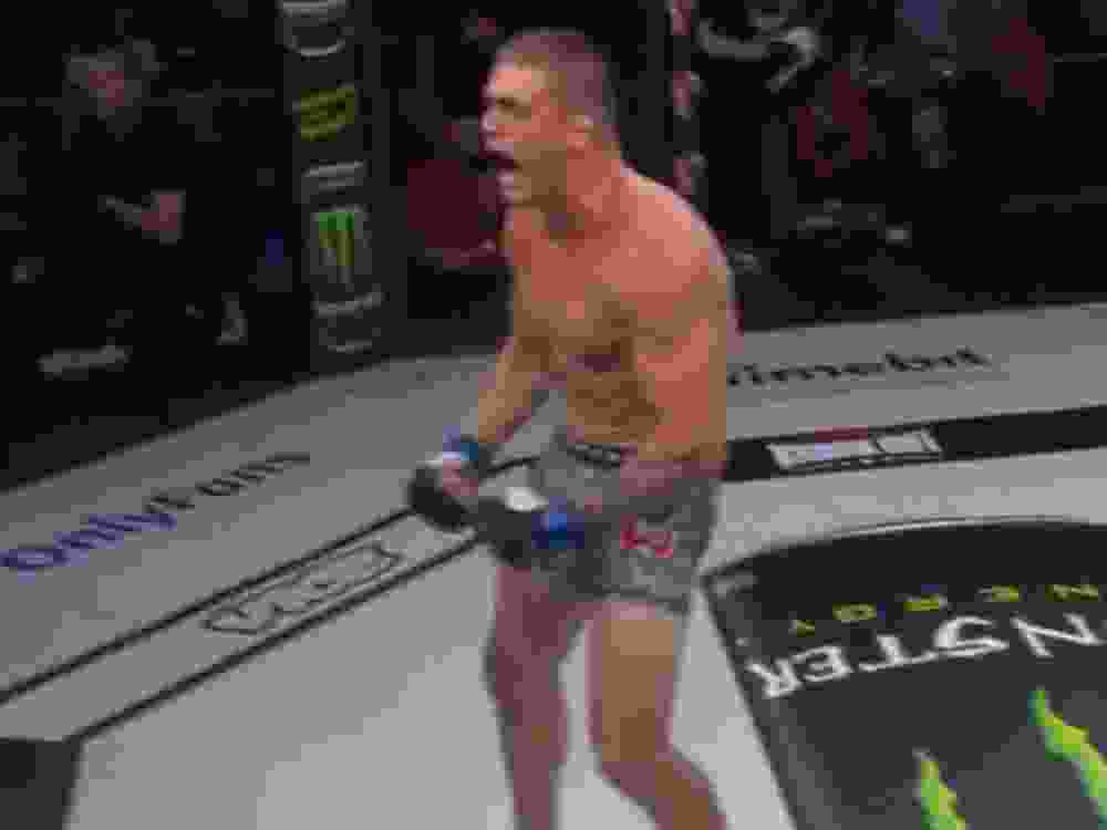 MMA fighter Jake Woodley celebrates his fast knockout victory.