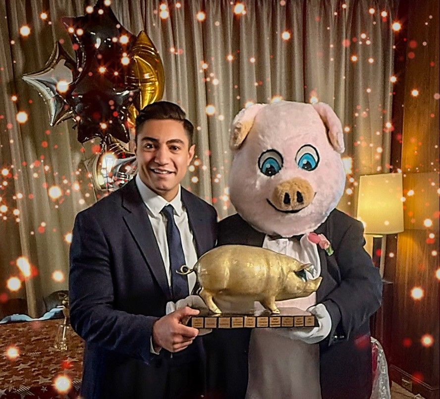 Franco Terrazzano, federal director of the Canadian Taxpayers Federation, hands out the federation's annual Teddy Waste Awards in Calgary, joined by event mascot Porky the Waste Hater