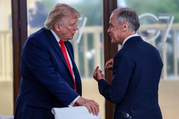 U.S. President Donald Trump speaks with Prime Minister Mark Carney at a working lunch with leaders of G7 and the Middle East, on June 16, 2026 in Evian-les-Bains, France. 