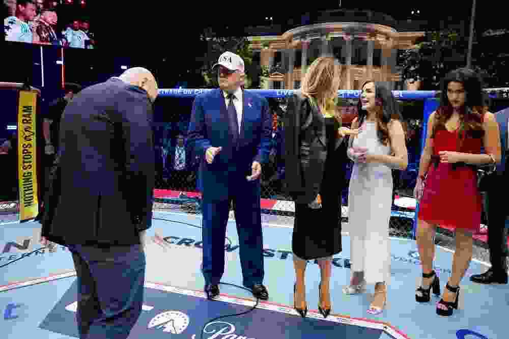 U.S. President Donald Trump, first lady Melania Trump, UFC CEO Dana White and other guests gather inside the Octagon at UFC Freedom 250 on the South Lawn of the White House on June 15, 2026 in Washington, DC. President Donald Trump hosted a series of Ultimate Fighting Championship matches on his 80th birthday, which the White House is calling "a once-in-a-generation celebration of the American fighting spirit.”