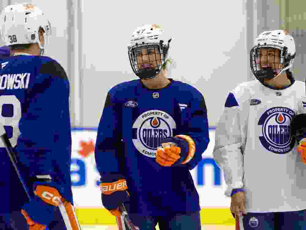 David Lewandowski (38), Caitlin Kraemer (47) and Chloe Primerano (88) take part in the Edmonton Oilers 2026 development camp.
