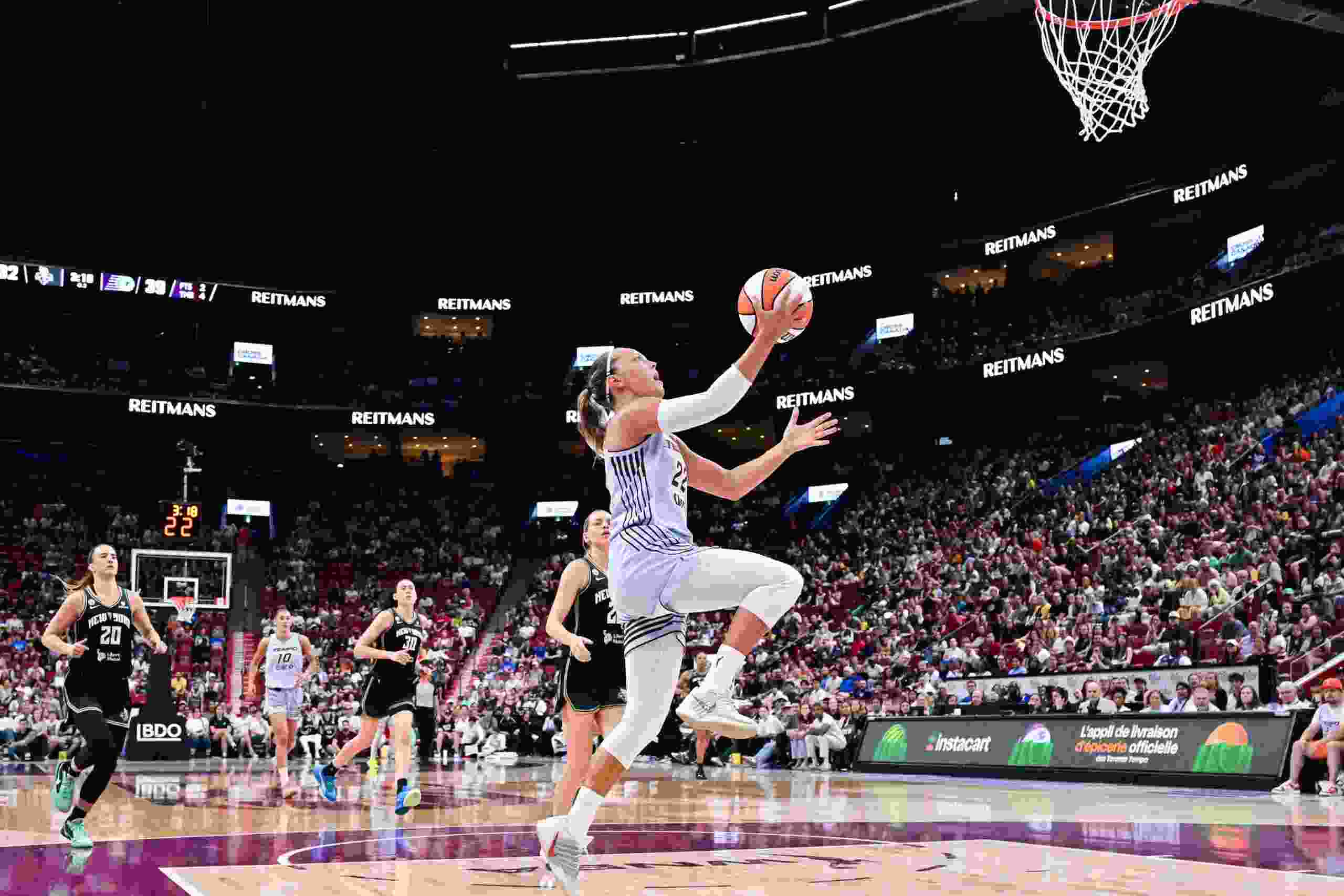Julie Allemand of the Toronto Tempo goes for a layup against the New York Liberty during WNBA game at the Bell Centre in Montreal on July 12, 2026.
