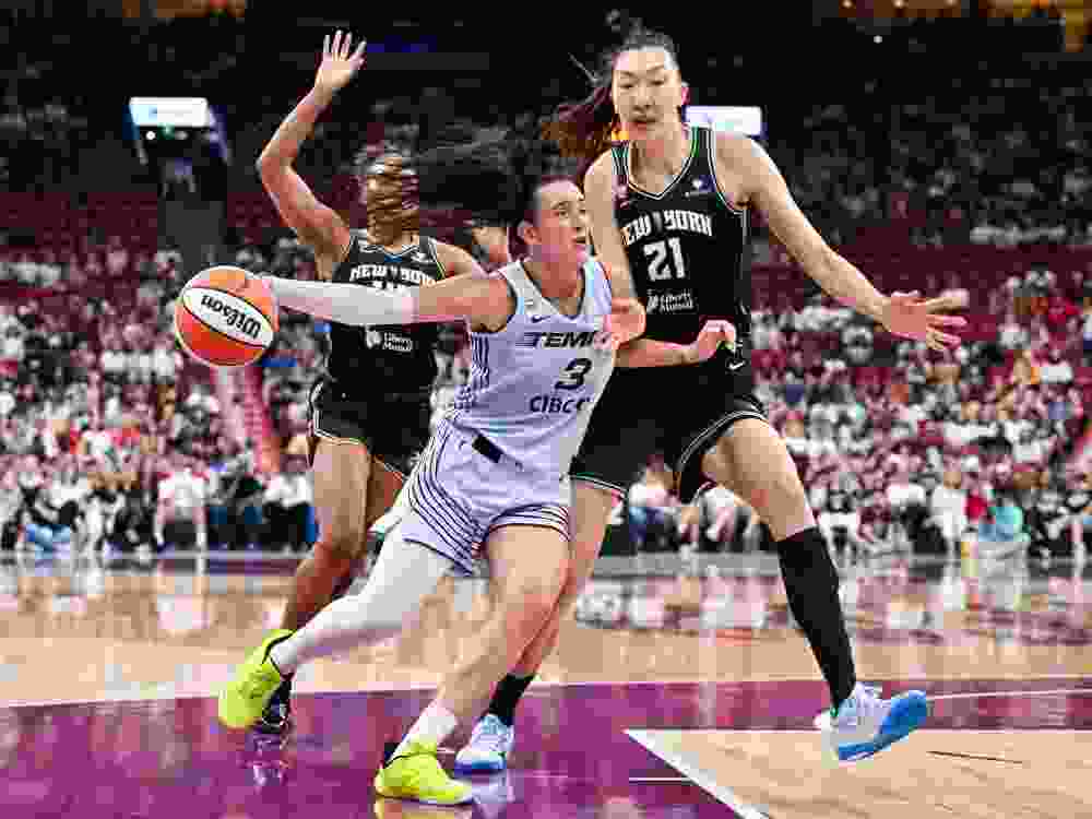Marina Mabrey of the Toronto Tempo drives to the basket against Han Xu of the New York Liberty during their game in Montreal on Sunday.