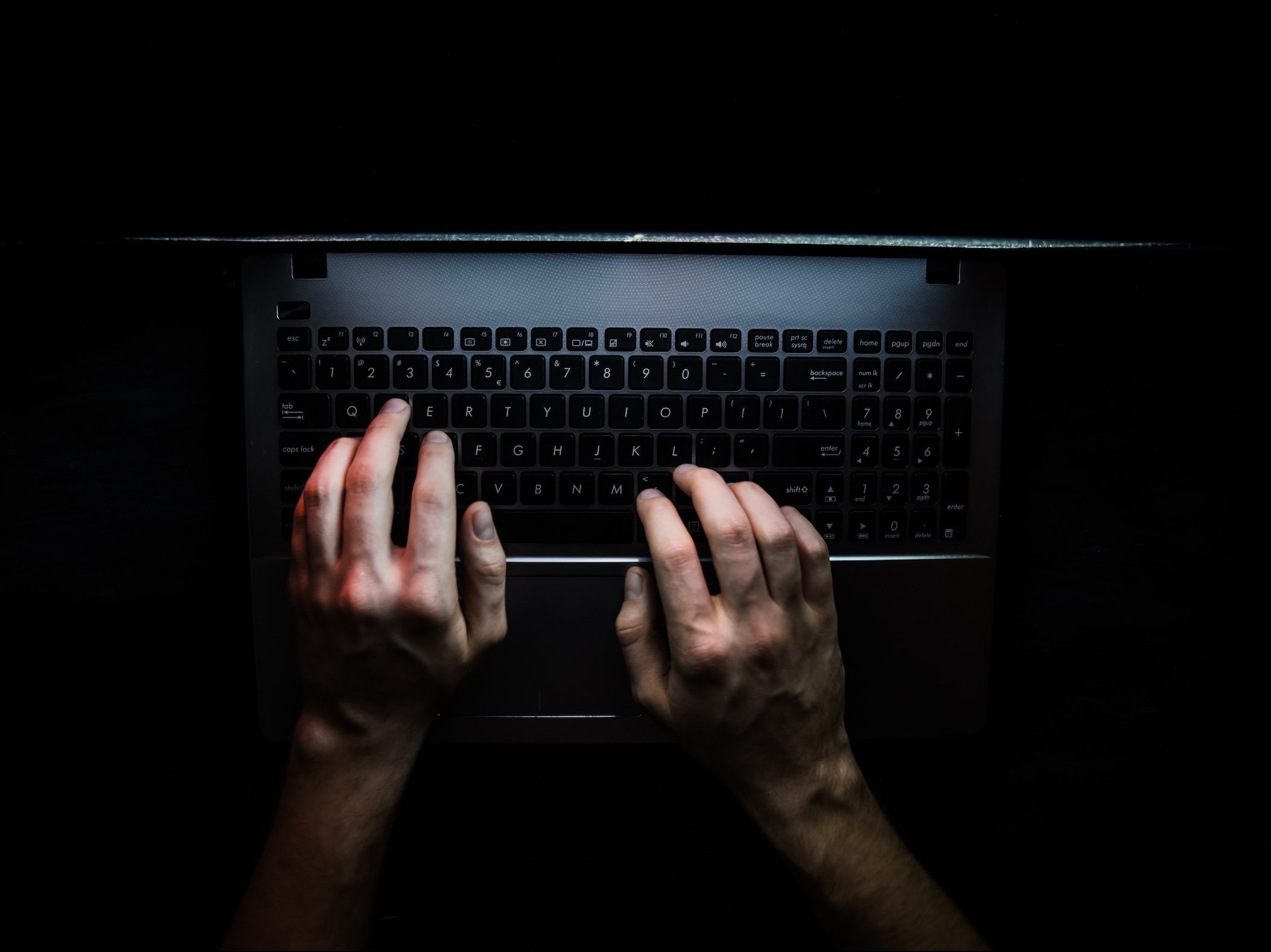 Hands using a keyboard.