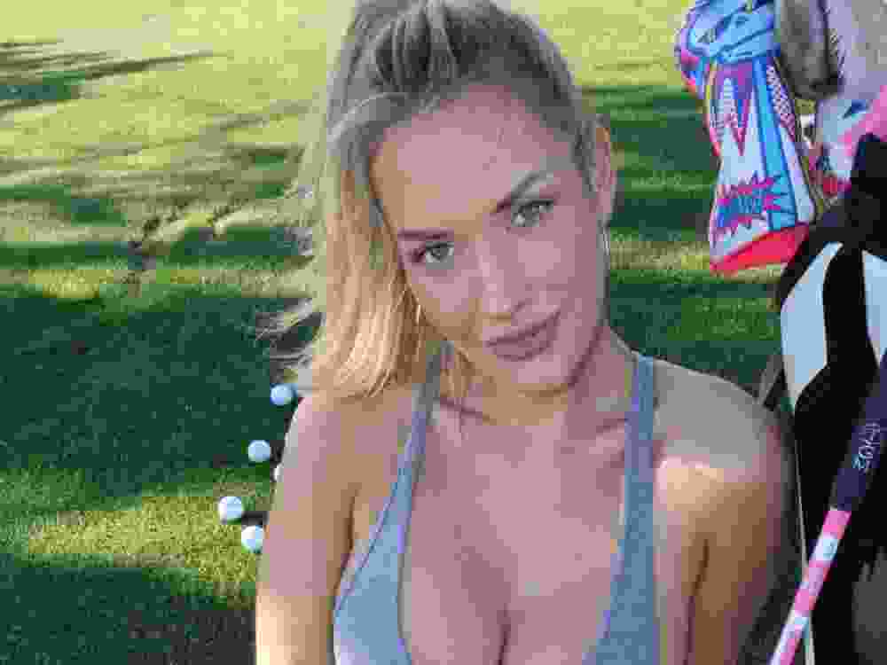 Golf influencer Paige Spiranac poses for a photo.