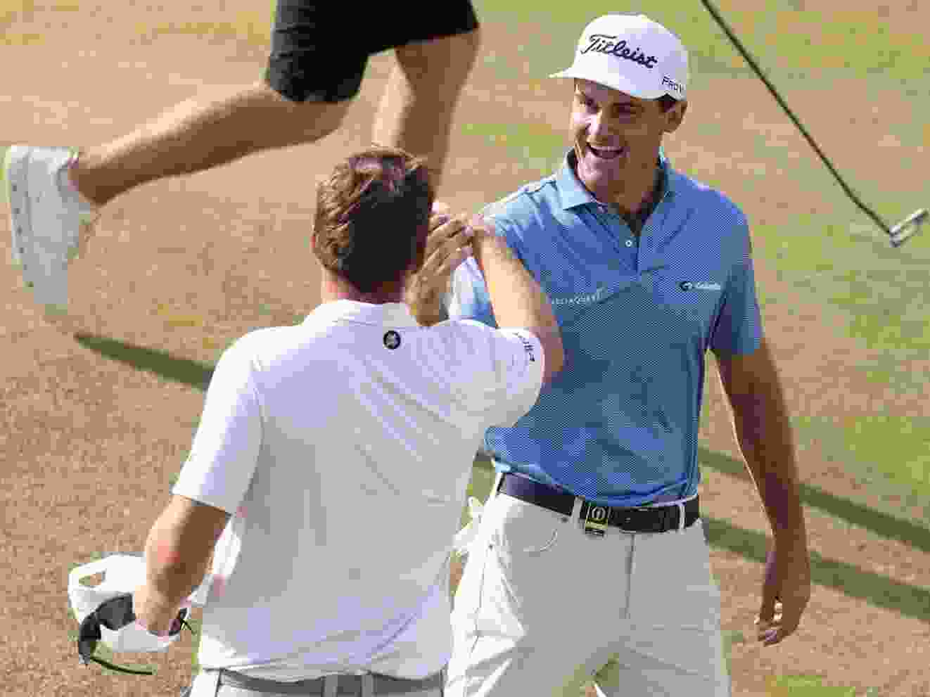 Jackson Suber of the United States and Sami Valimaki of Finland shake hands.
