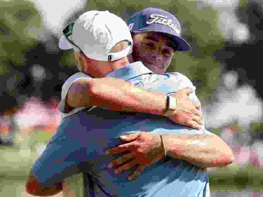 Jackson Koivun, a 21-year-old American in only his third PGA Tour event as a professional, hugs father George Koivun after winning the 3M Open.