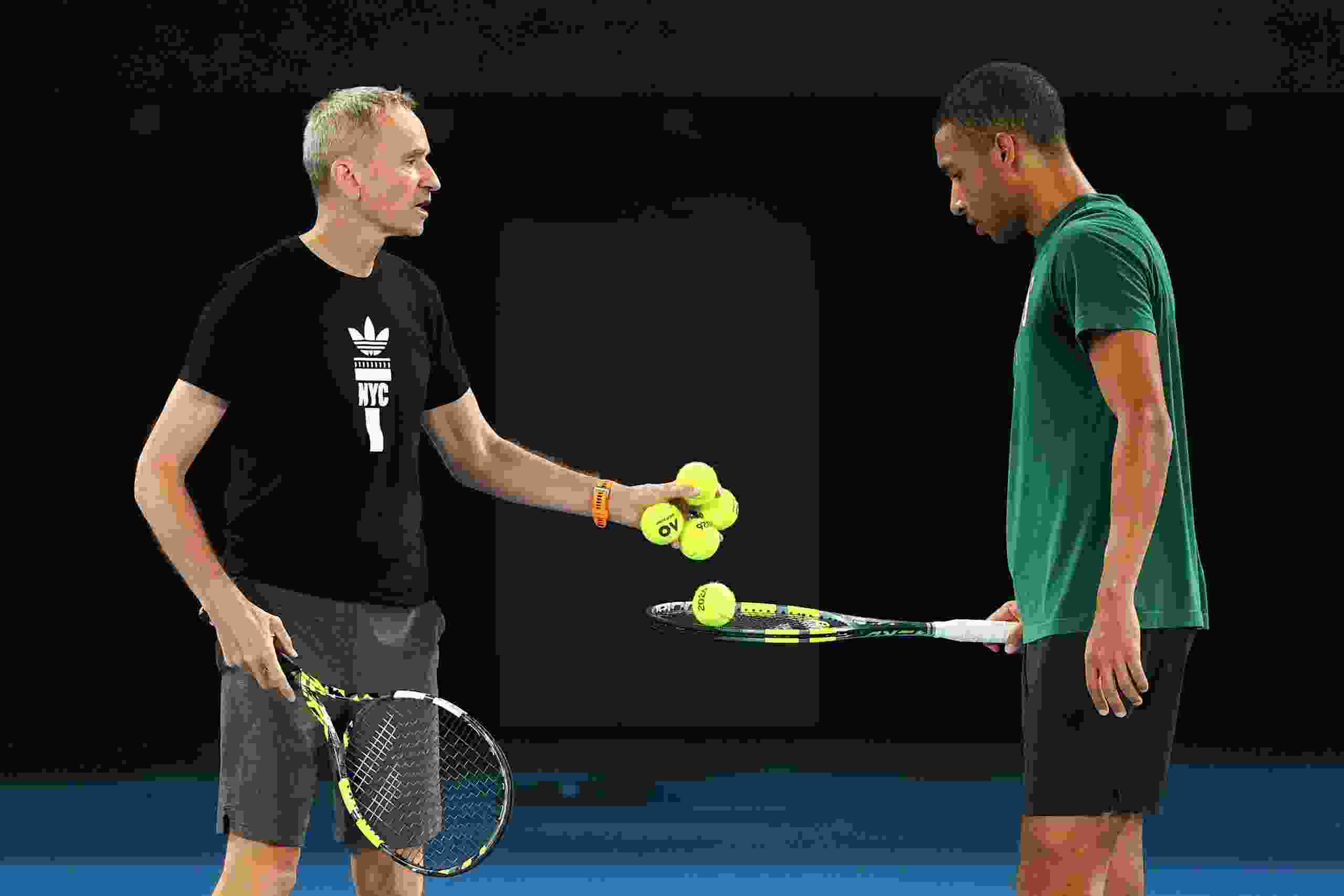 Félix Auger-Aliassime, right, chats with coach Frédéric Fontang during a practice session ahead of the 2026 Australian Open at Melbourne Park on Jan. 9, 2026 in Melbourne, Australia.