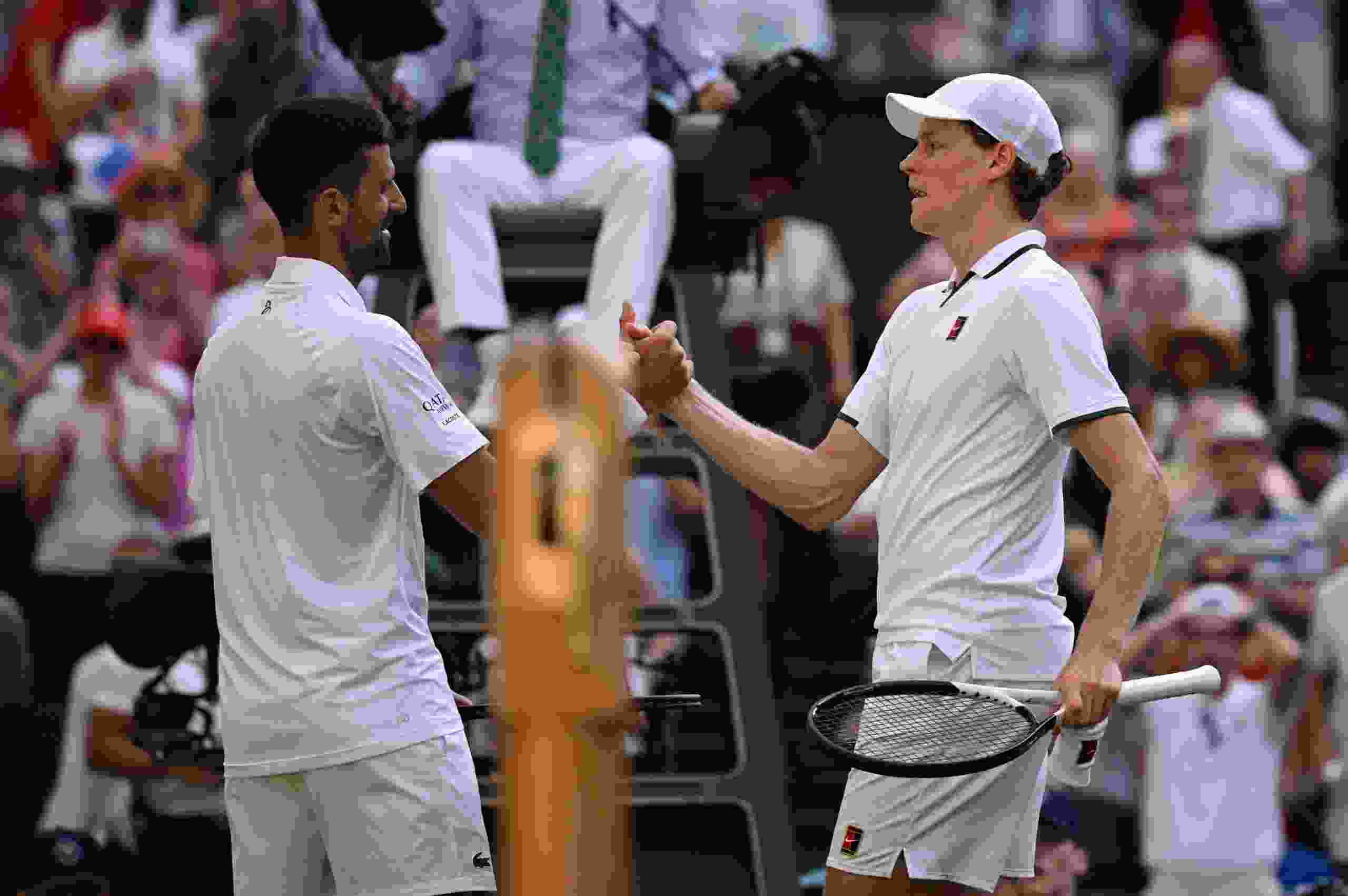 Novak Djokovic of Serbia and Jannik Sinner of Italy interact at the net following their Gentlemen's Singles semifinal match on Day 12 of The Championships Wimbledon 2026 at All England Lawn Tennis and Croquet Club on July 10, 2026 in London, England.