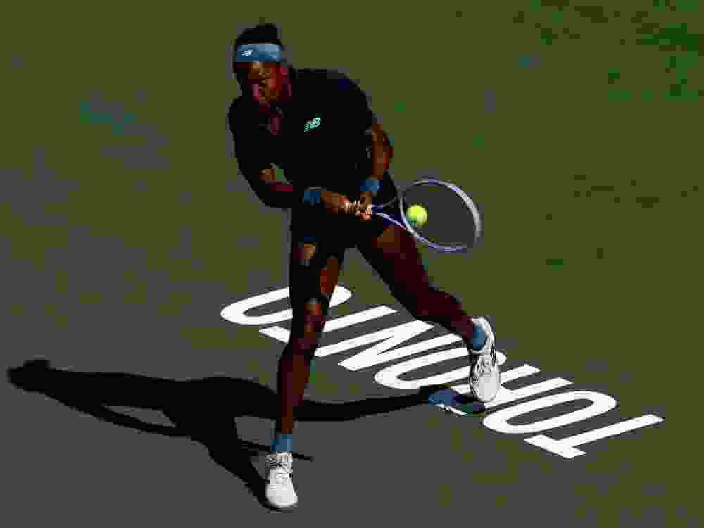 Coco Gauff returns a shot to Kayla Day during the National Bank Open in Toronto.
