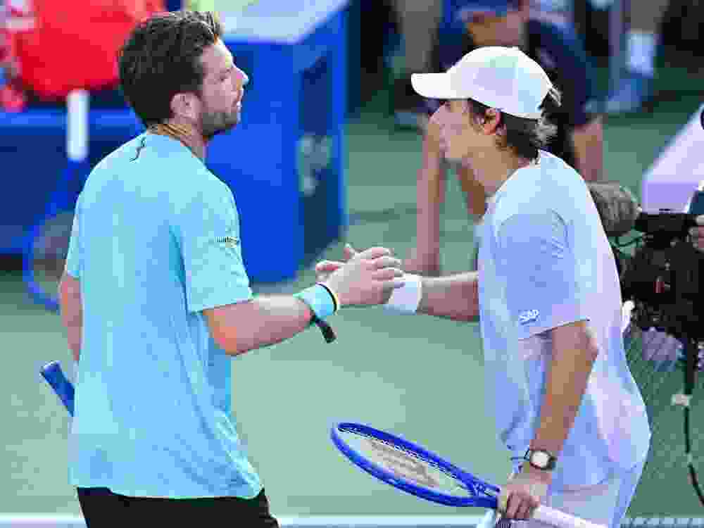 Cameron Norrie (left) and Alex de Minaur shake hands