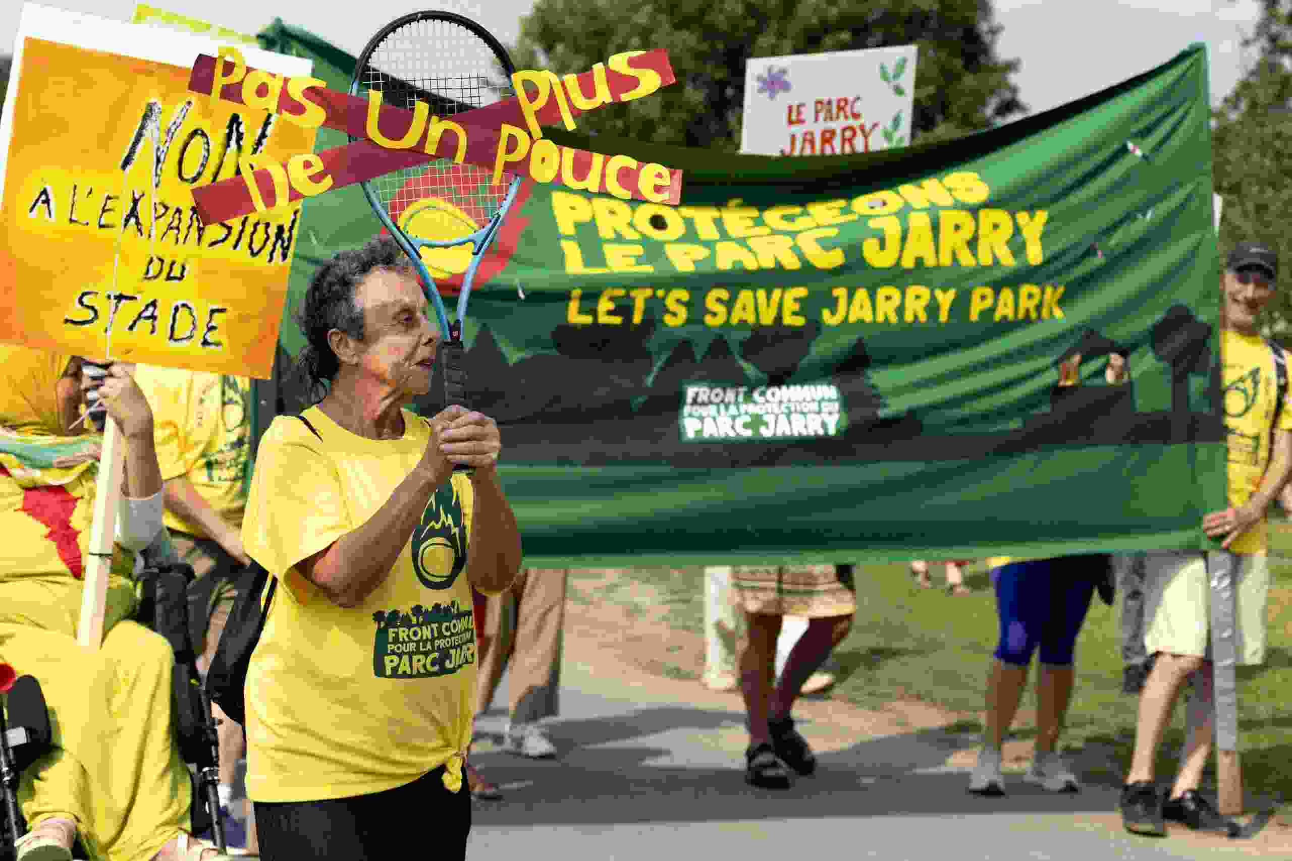 People protest Tennis Canada's proposed expansion project for its Jarry Park stadium in Montreal on Sunday, August 9, 2026.