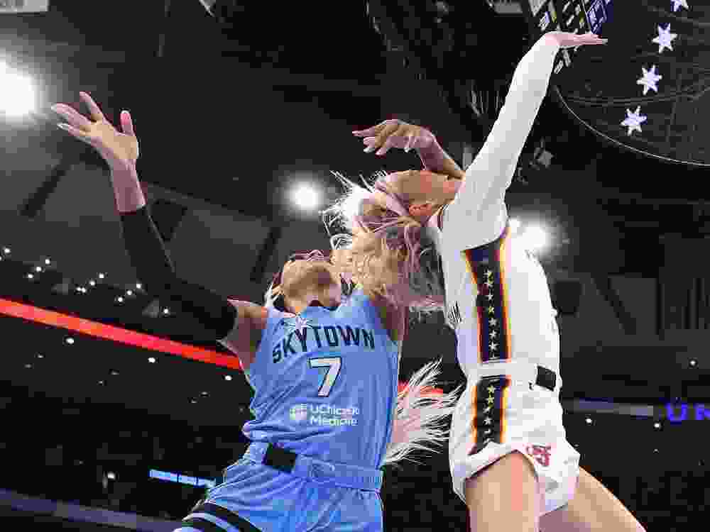 Sophie Cunningham of the Indiana Fever is fouled by DiJonai Carrington of the Chicago Sky during a WNBA game last week.